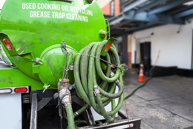 grease trap pumping truck in action in Chesterton, IN